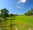 The par-5 10th hole at Vaaler Creek Golf Club features a split fairway off the tee and then an uphill slope to an elevated green. 