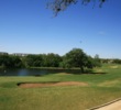 The sixth hole on the Lakes nine at Hill Country Golf Club wraps around a pond. 