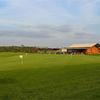 A view of the putting green and pro shop at The Buckhorn Golf Course