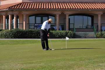 A view of the clubhouse and putting green at Fort Sam Houston Golf Course